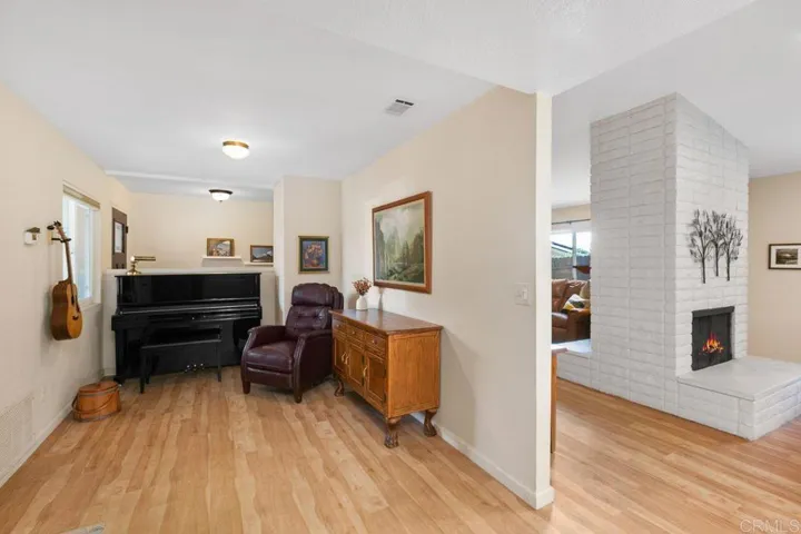 This would be the dining room, currently used as a music or hobby room.