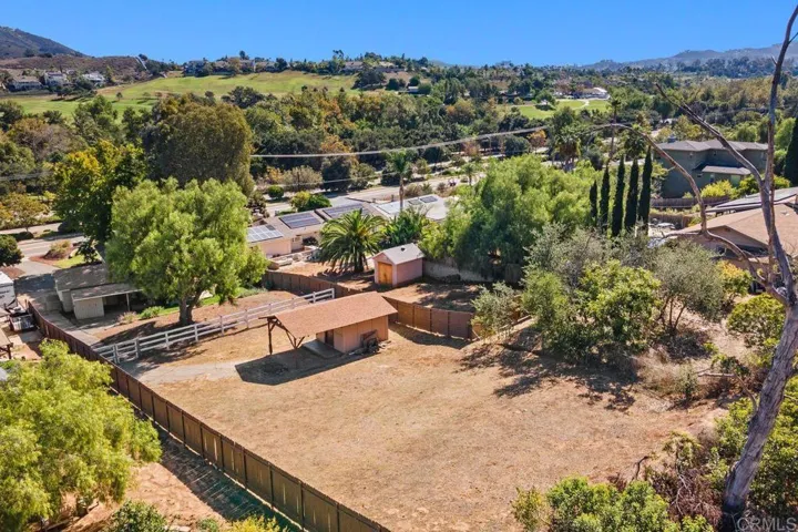 This is the exterior back showing the back yard and the large bonus space above, roughly 60'x100'.