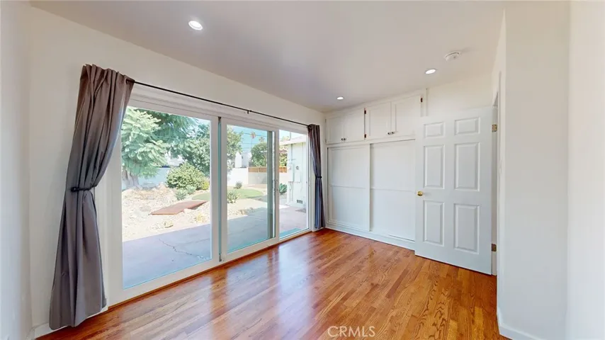 Bedroom #2 with slider to beautiful backyard!