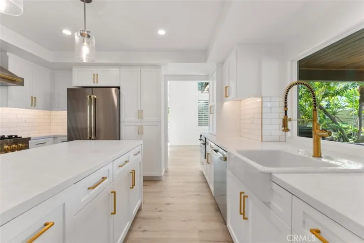 The kitchen features under cabinet lighting.