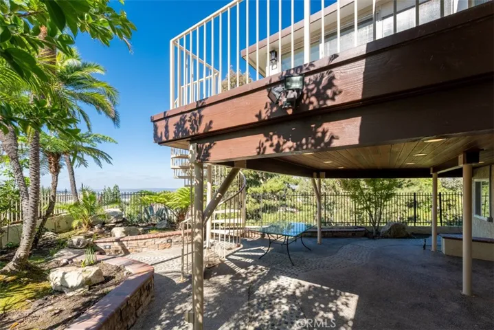 The backyard features stunning views and ample space for hosting.