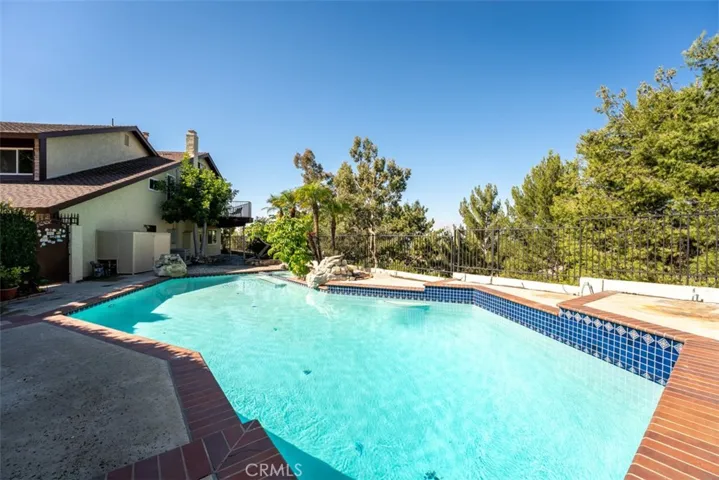 The house features an large pool, which is diving board deep.