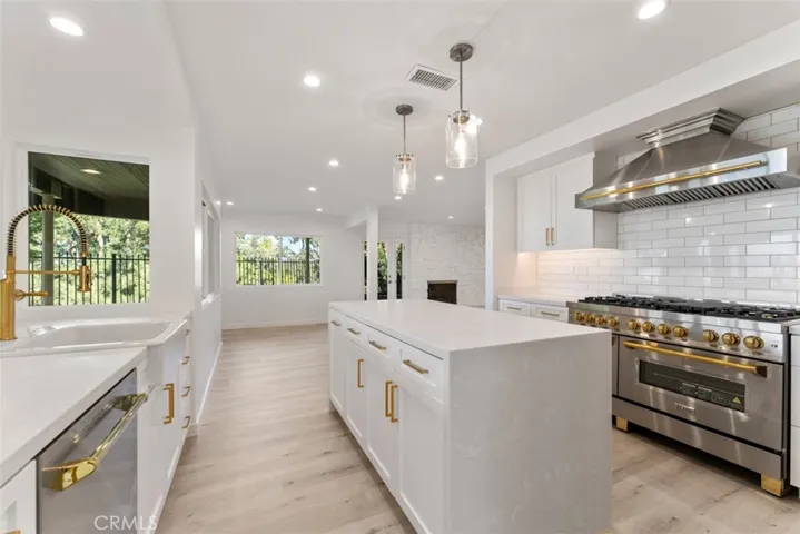 The kitchen island features a double waterfall.