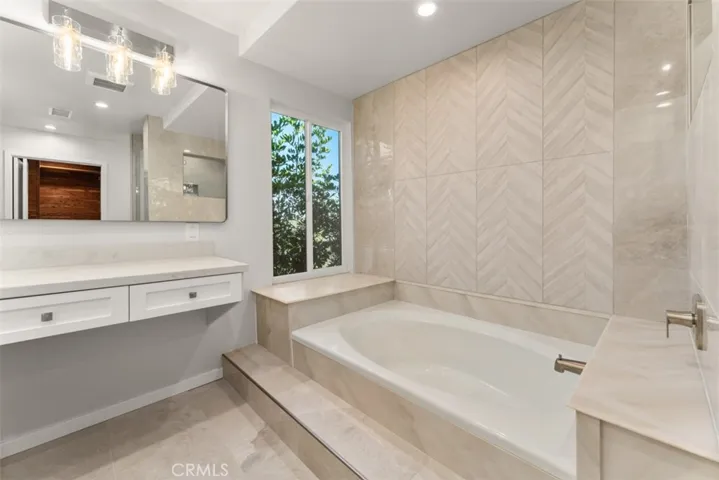 The primary features an overside bathtub.