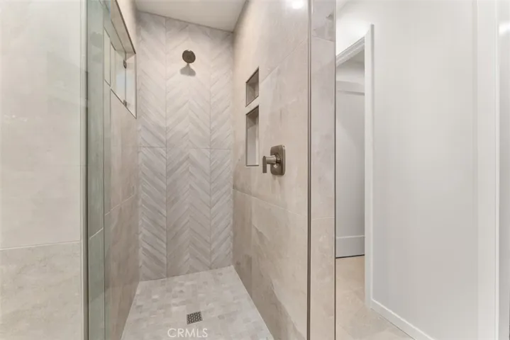 A custom walk-shower, with built in storage.
