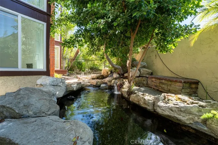 The home features a very large natural rock koi pond.