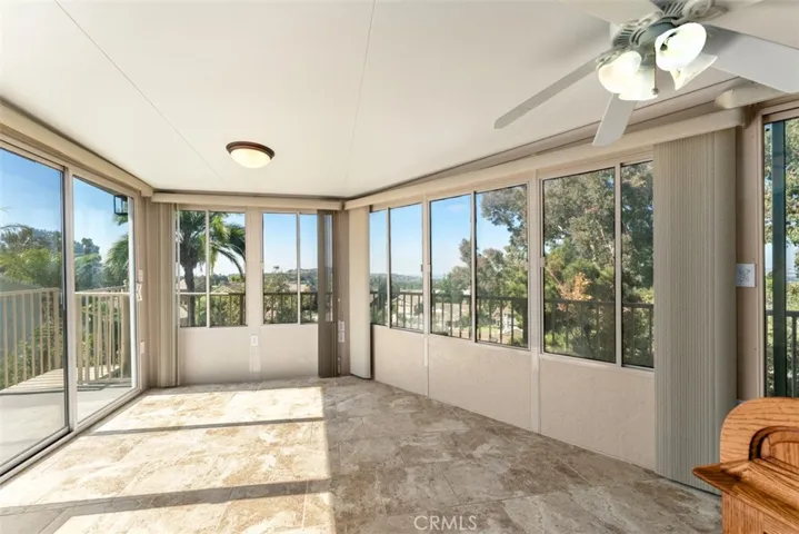 The primary room office/sitting room shares a balcony with the first guest room.