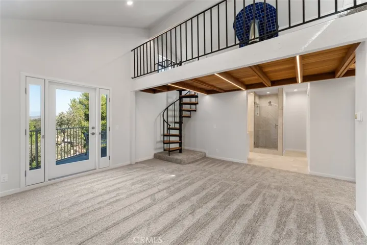 The primary room is comprised of two stories, main room, office/view room, two balconies, large en-suite, and cedar lined walk in closet.