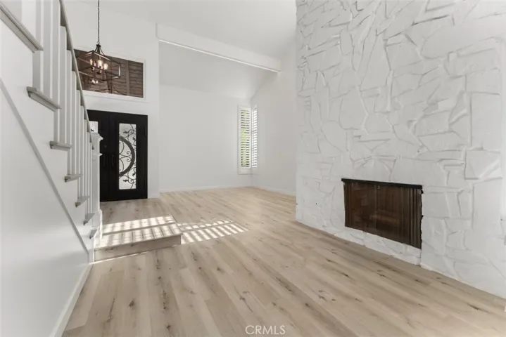 The first fireplace in the sitting room between the living room and dining room.