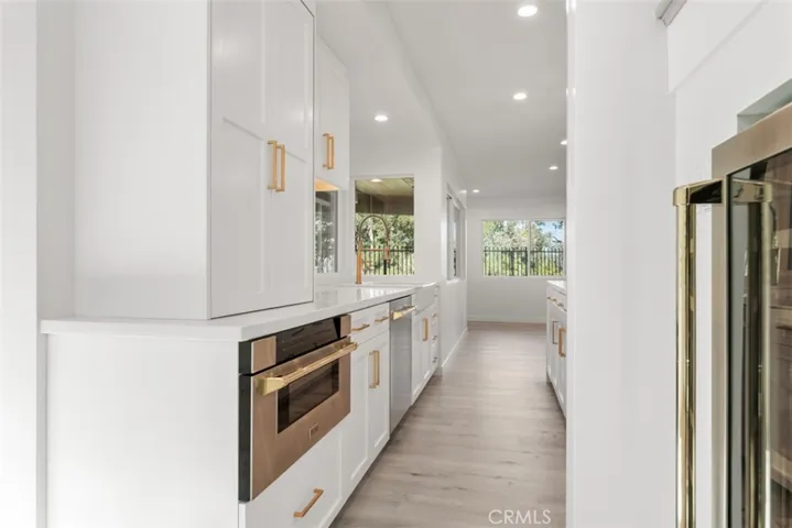 The microwave is a drawer style with an appliance garage above.
