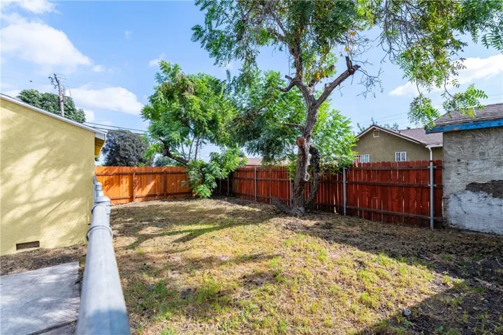 Back yard space with strong potential for expansion, additional parking, gardening, or entertaining.