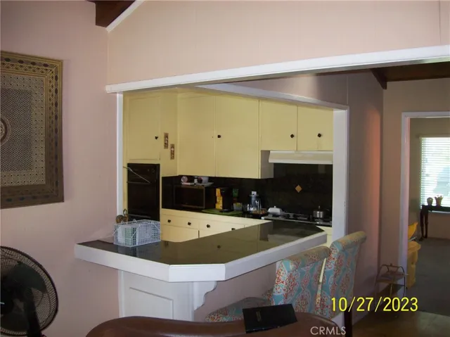 VIEW OF BREAKFAST BAR AND KITCHEN
