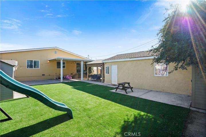 Backyard- synthetic grass & converted garage