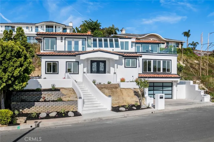 A three-car garage, extra driveway parking add to its undeniable desirability.