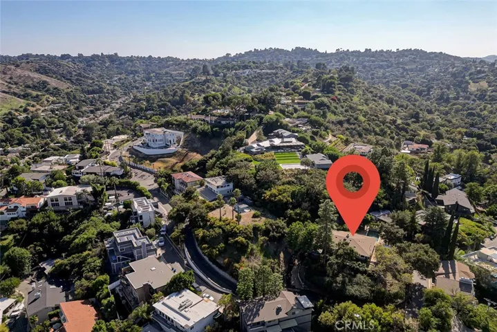 Nestled on hill surrounded by trees creating an extreme amount of privacy