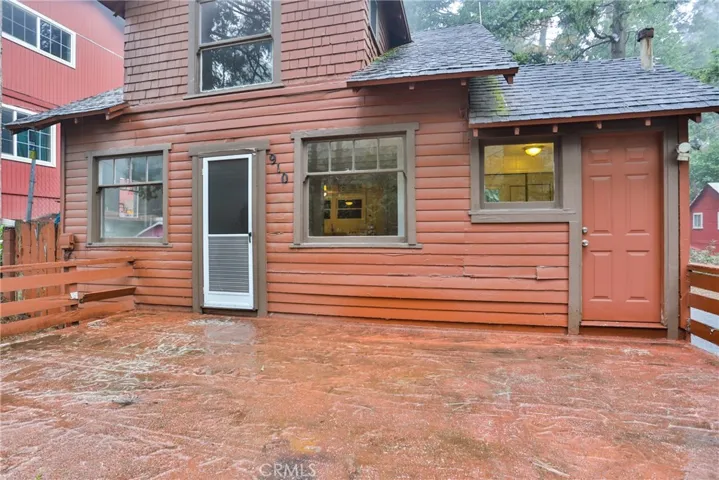 deck with door to mud room and living room