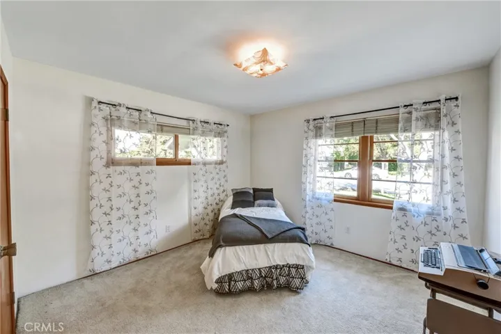 THIRD BEDROOM , ORIGINAL HARDWOOD FLOORS UNDER CARPET LIGHT AND BRIGHT