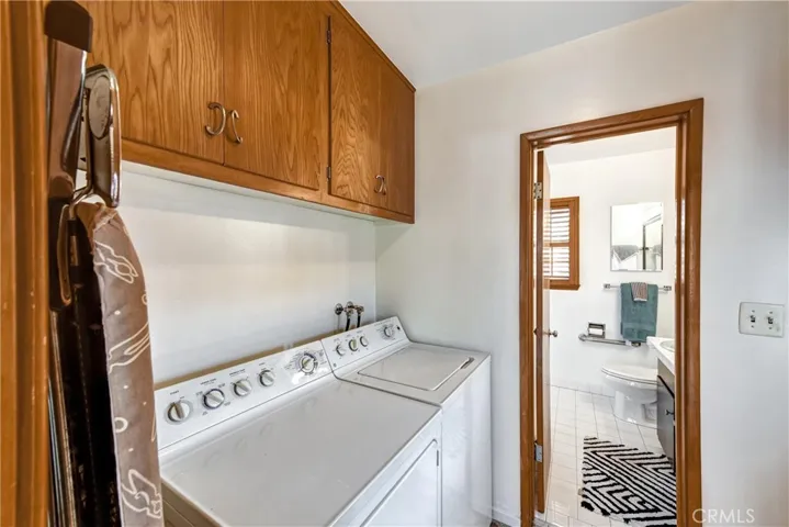 WASHER AND DRYER OFF OF KITCHEN WITH LOTS OF STORAGE