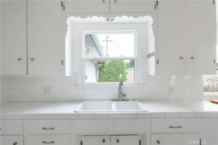 The kitchen is so charming and bright, that you won't mind washing dishes!