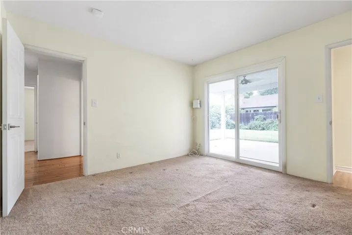 Bedroom #3 with double pane slider to back yard.