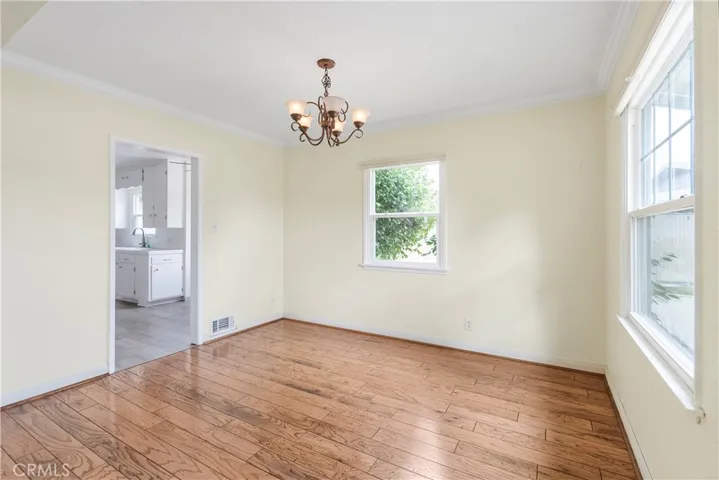 Formal dining room with entry into the spacious kitchen with breakfast nook.