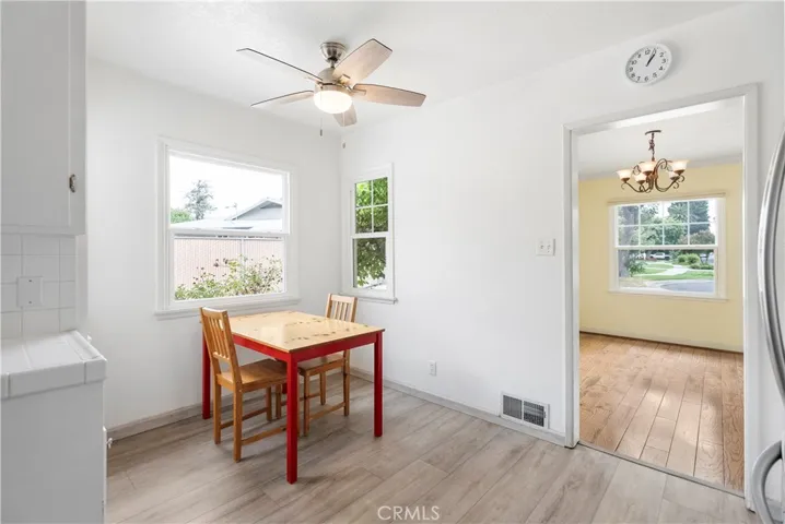 Breakfast nook area with view into the formal dining room.