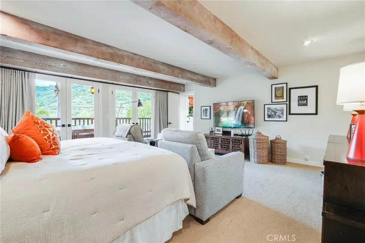 While overlooking gorgeous unobstructed views with tremendous privacy, the primary suite does have black-out curtains for when you want to sleep in.