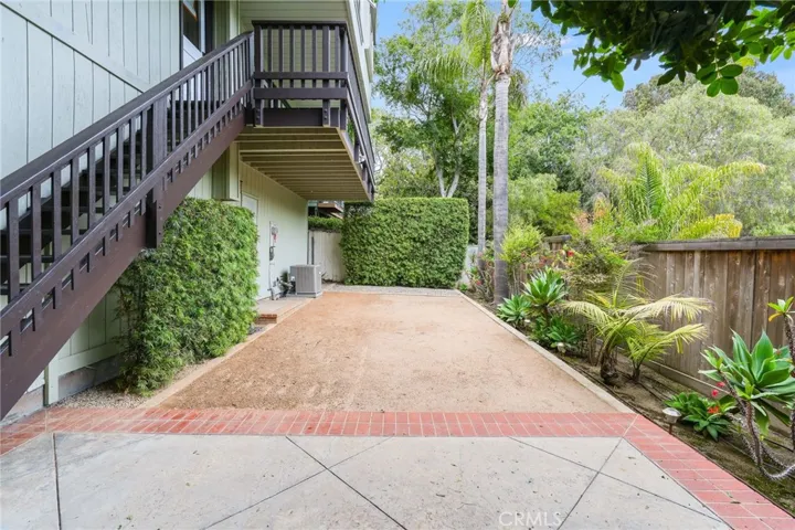 The rear yard has been re-worked for drought tolerance (decomposed granite, drought resistant plantings, efficient drip system).