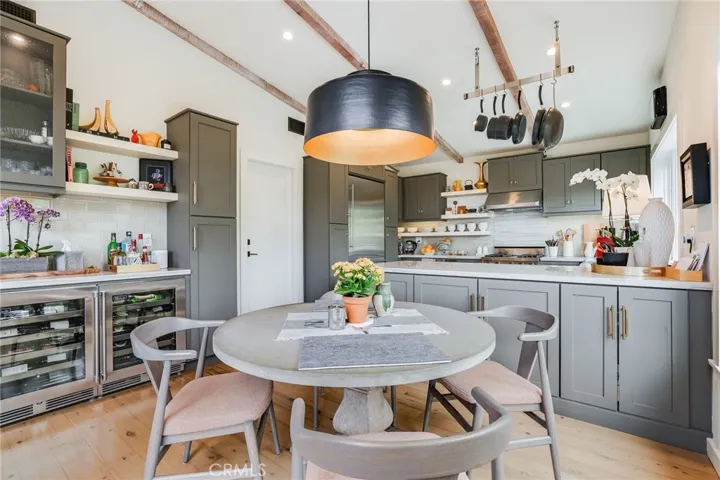The kitchen and dining areas have an amazing amount of storage, and includes two Perlik wine refrigerators (white and red), two Subzero refrigerated drawers, and Liebherr primary refrigerator.