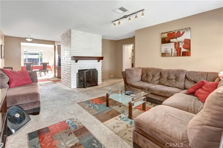 Living Room/Great Room  w/newer windows through out he home. Gas or wood burning Fireplace,  Force air Gas Heating System