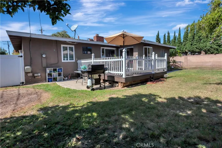 Backyard of home with decking to enjoy your yard.  Enjoy your time in the front or backyard of this Lovely home.