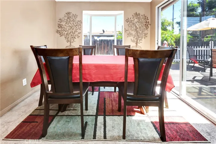 Formal Dining Room with Garden Window and Sliding Window door that leads to the Backyard deck.
