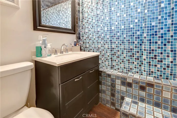 Bathroom (Full) With designer Sink and Mirror. Tub/Shower is very unique and faucet has been upgrade