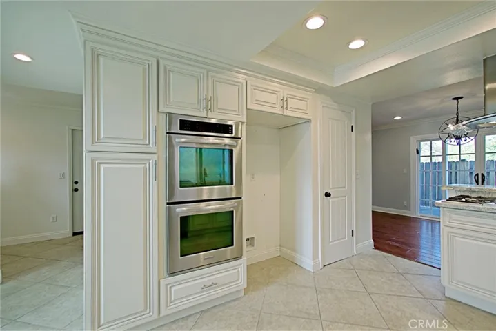 Double oven with microwave above in the cabinet
