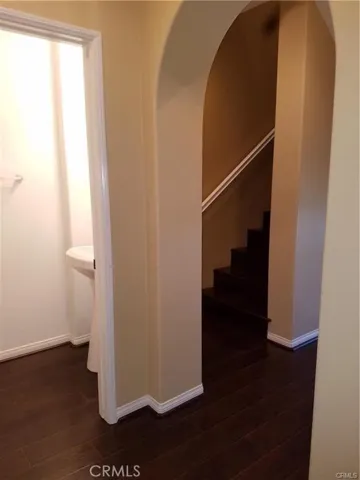 Partial view of powder bath and staircase going to 3rd floor.