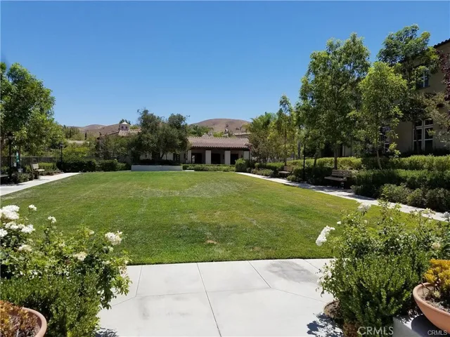 Grassy area with clubhouse in the distance