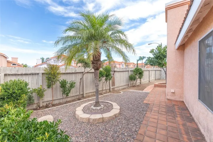 The side of the house has ample space for further landscaping or planting