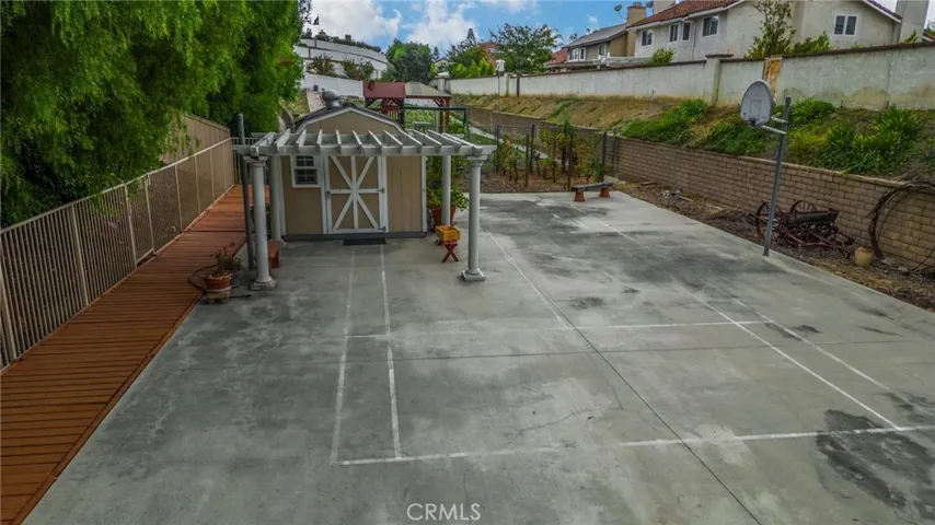 Sport court is currently shared with one of two Tuff Sheds on the property, however it could be easily relocated if you want to make full use of the court!