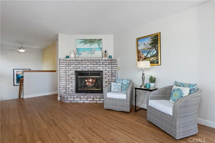 Living Room with Brick gas Fireplace with hearth