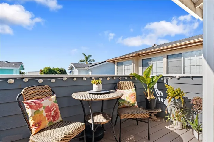 Front Balcony with Peeks of the Ocean!