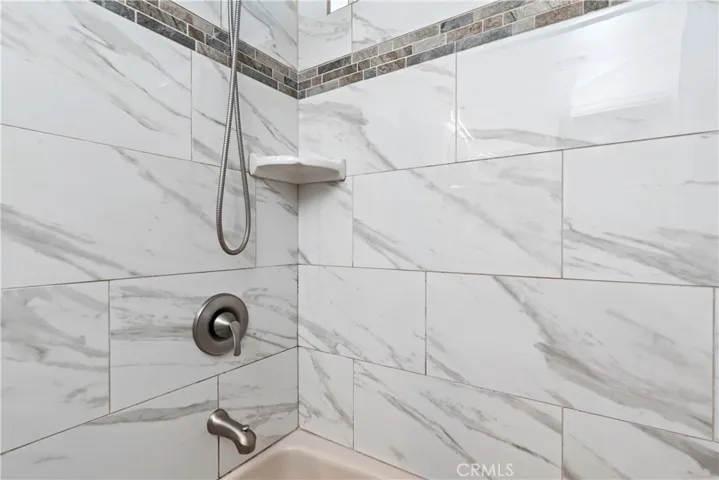 Newer Tile in shower/Tub Upstairs Bathroom