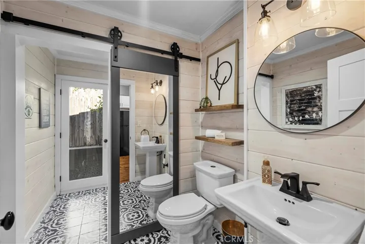 Half bath off laundry room with side yard access