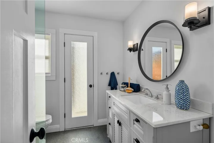 Downstairs 3/4 bathroom with side yard access.