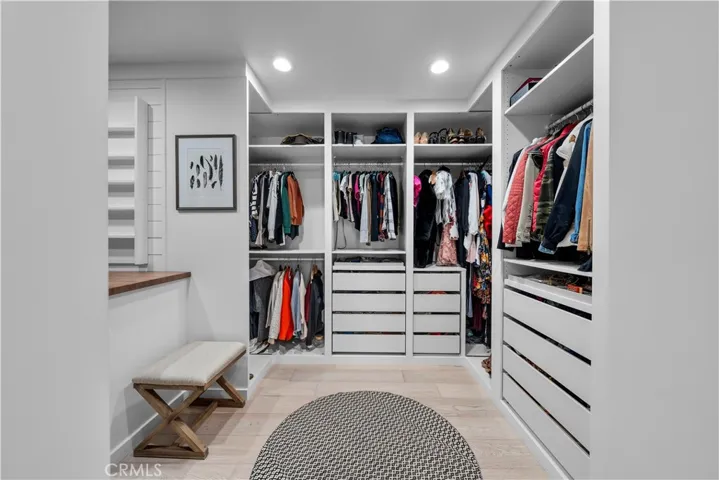Primary bedroom walk-in closet