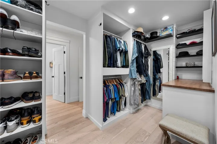 Primary bedroom walk-in closet