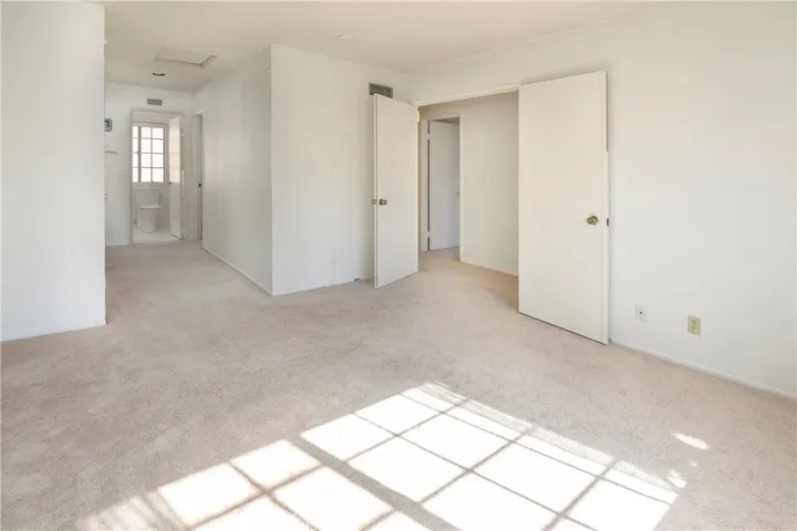 Primary suite with double door entry has 2 closets; one of which is a walk in closet!