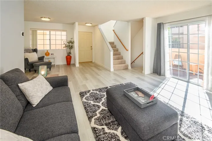 Direct access to private patio from Living room. TV bracket in living room will stay.