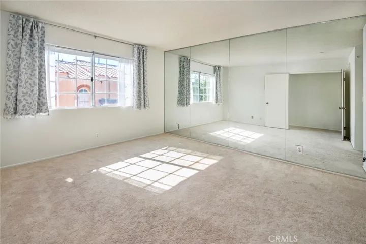 Light and bright Primary suite with double door entry way and 2 closets.