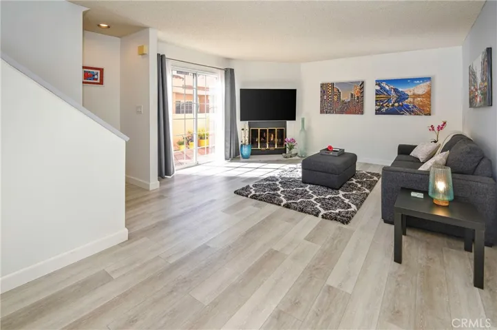 Spacious living room with direct access to private patio