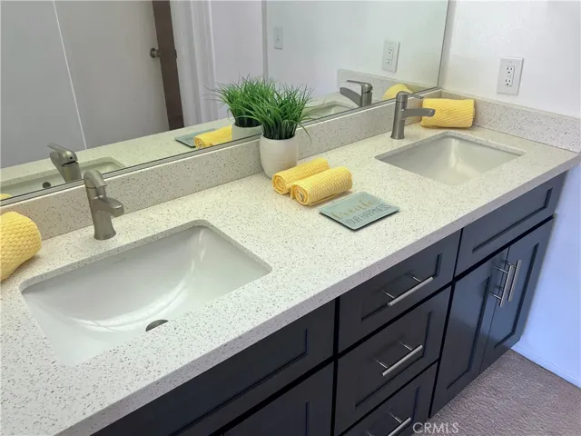 Primary suite with double door entry has 2 closets; one of which is a walk in closet!